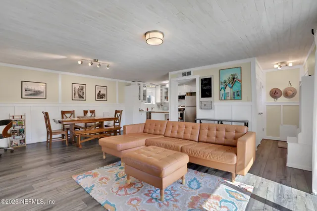 a living room with fireplace furniture and a flat screen tv