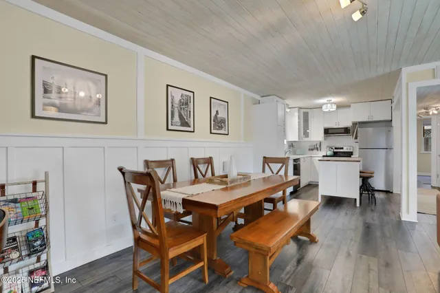 a kitchen with a refrigerator a stove top oven a sink and dishwasher