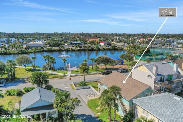a front view of a house with a yard table and chairs