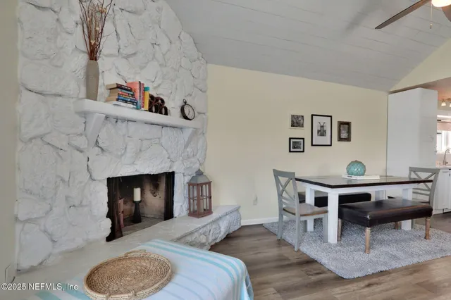 a swimming pool with outdoor seating and yard