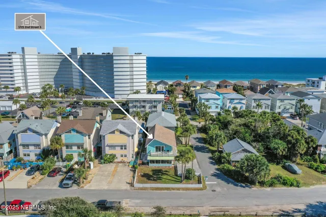 a front view of a house with a yard table and chairs
