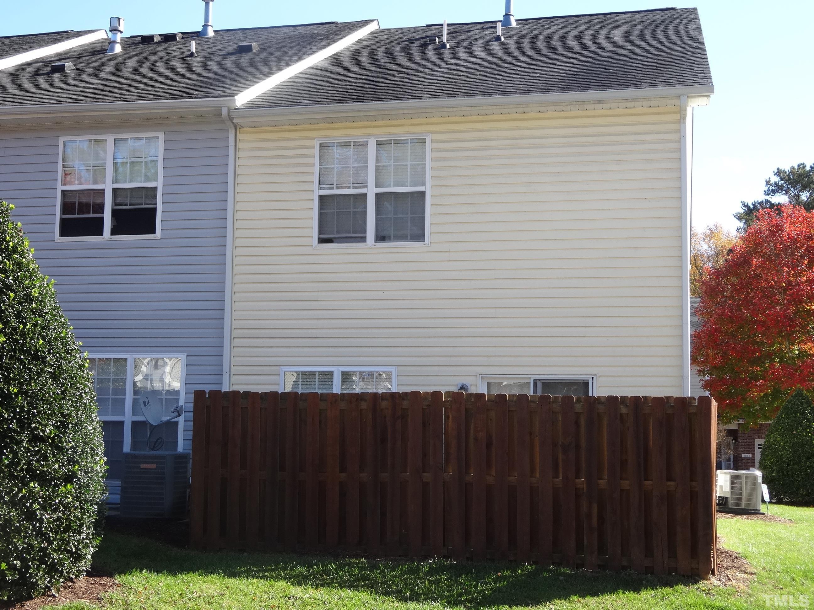 The patio is protected by the privacy fence