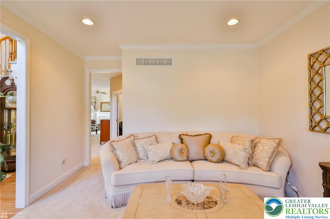 1991 Autumn Ridge Road Lower Macungie Township, PA 18062 - Photo 12 of 71 a living room with a couch and a coffee table