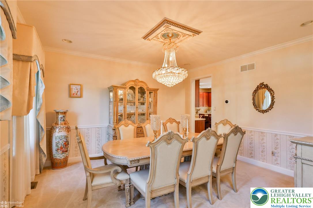1991 Autumn Ridge Road Lower Macungie Township, PA 18062 - Photo 13 of 71 a view of a dining room with furniture and chandelier