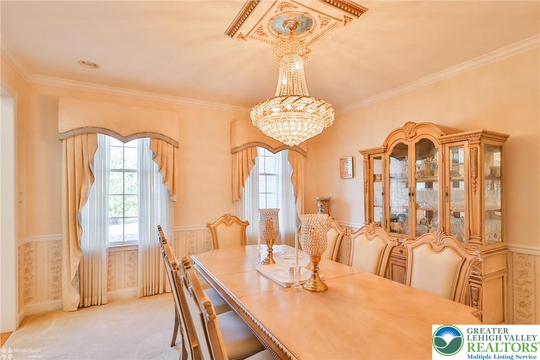 1991 Autumn Ridge Road Lower Macungie Township, PA 18062 - Photo 15 of 71 a view of a dining room with furniture and chandelier