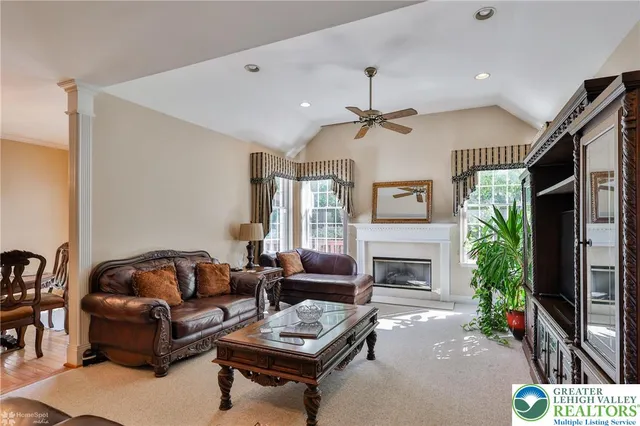 a view of an entryway with wooden floor and a chandelier