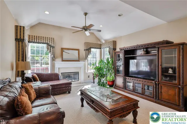 a kitchen with stainless steel appliances granite countertop wooden cabinets a sink and a stove