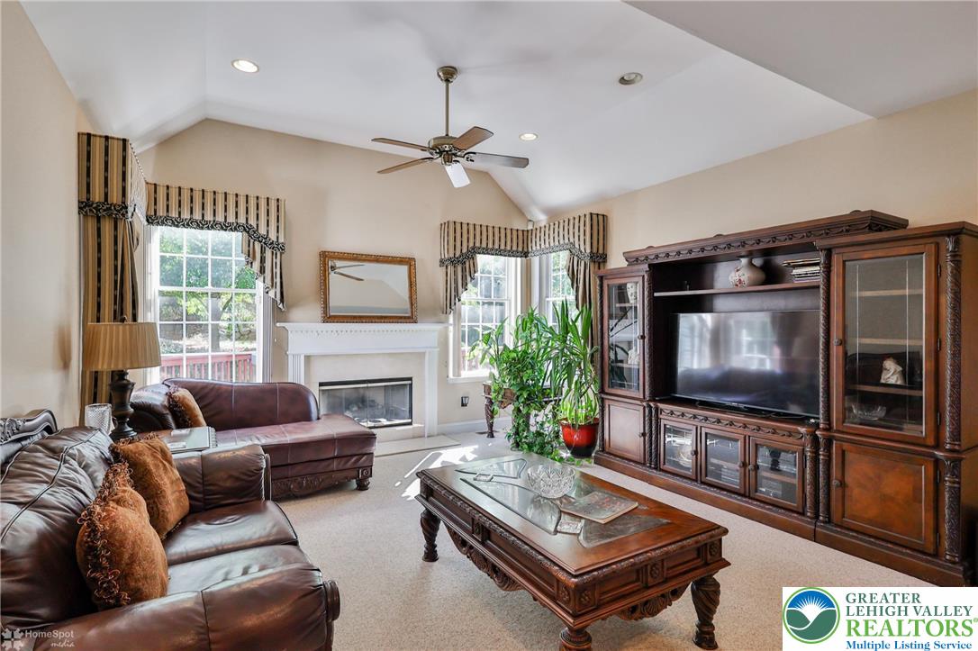1991 Autumn Ridge Road Lower Macungie Township, PA 18062 - Photo 18 of 71 a living room with furniture and a flat screen tv