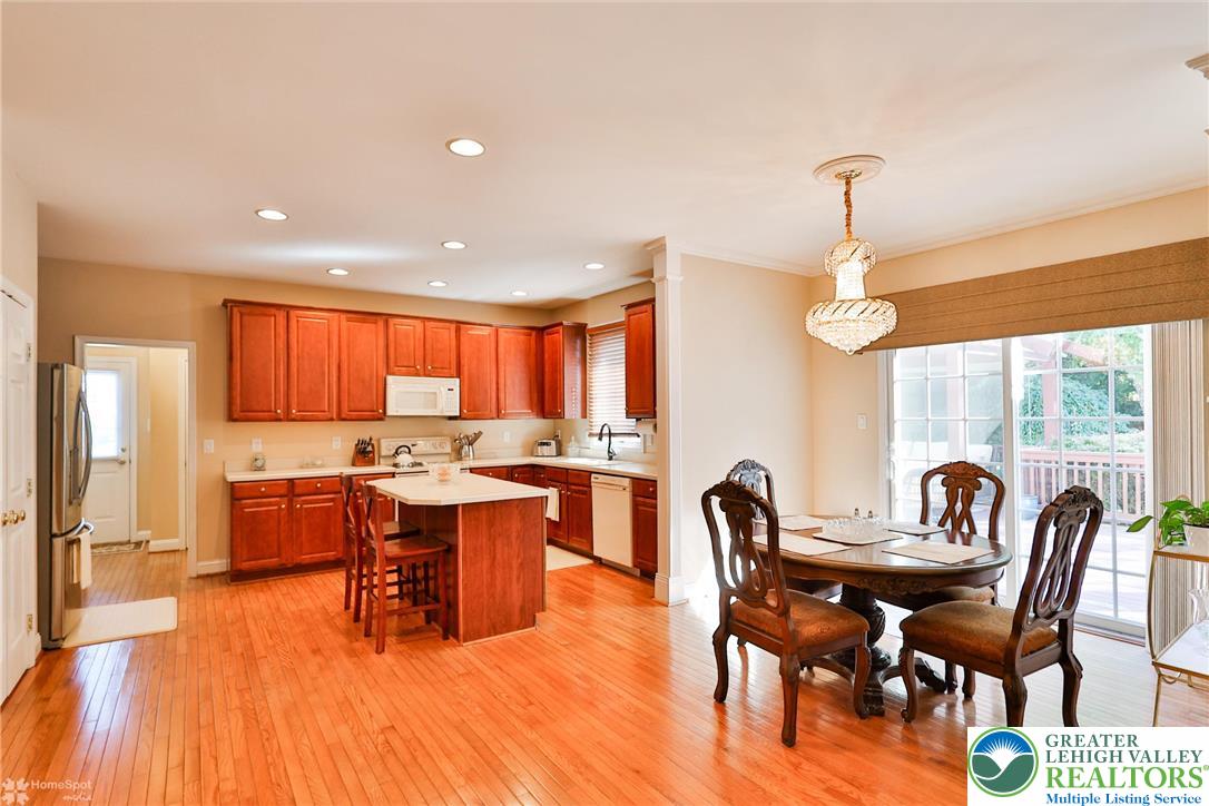 1991 Autumn Ridge Road Lower Macungie Township, PA 18062 - Photo 21 of 71 a view of a dining room with furniture window and wooden floor