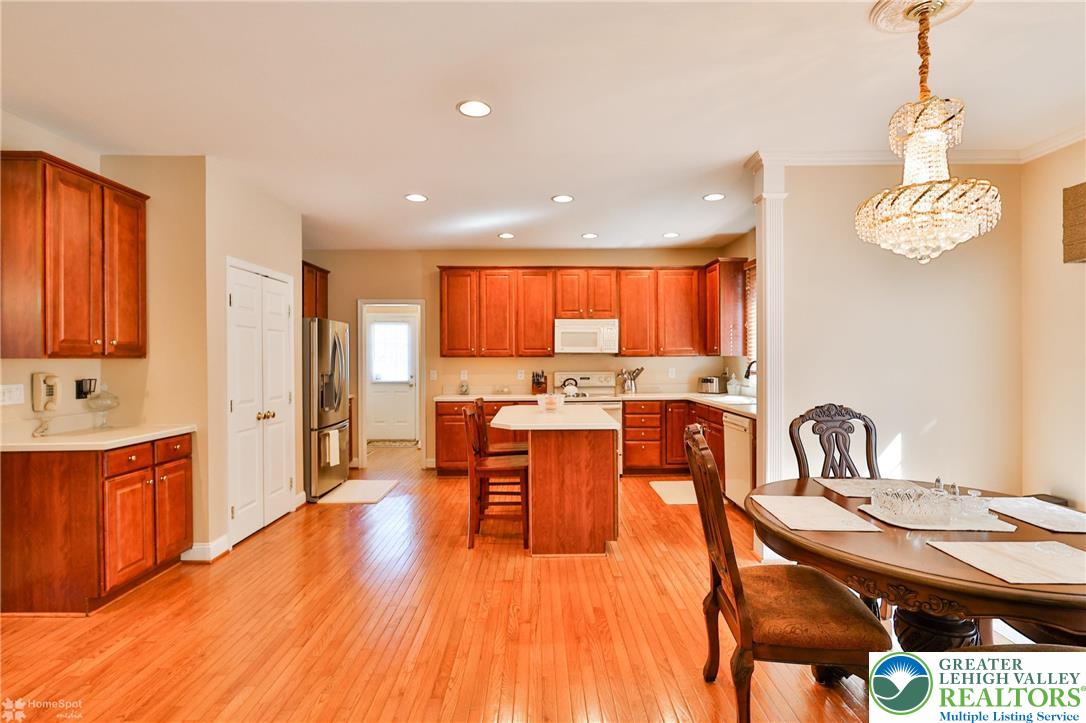 1991 Autumn Ridge Road Lower Macungie Township, PA 18062 - Photo 22 of 71 a kitchen with stainless steel appliances granite countertop a sink a stove and a wooden floors