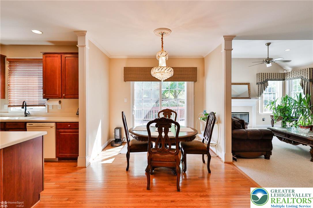 1991 Autumn Ridge Road Lower Macungie Township, PA 18062 - Photo 23 of 71 a dining room with furniture a chandelier and wooden floor