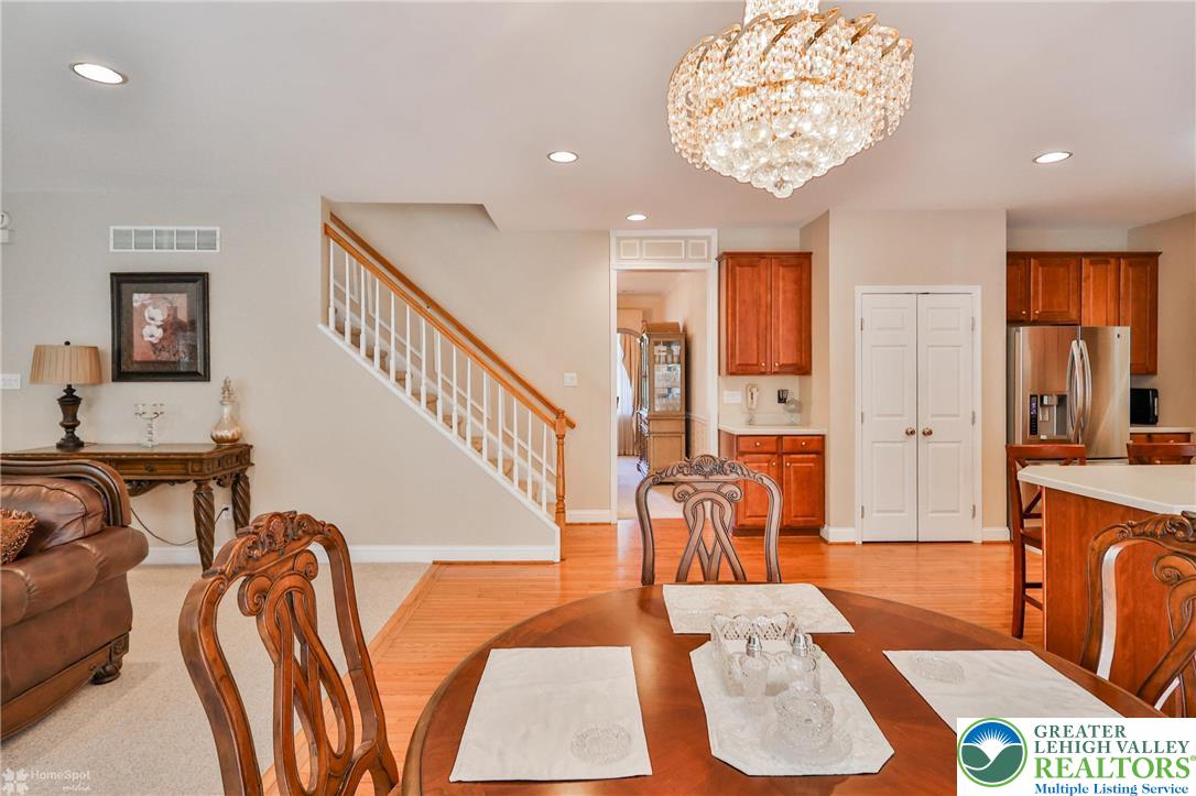 1991 Autumn Ridge Road Lower Macungie Township, PA 18062 - Photo 24 of 71 a view of an entryway with wooden floor and a chandelier