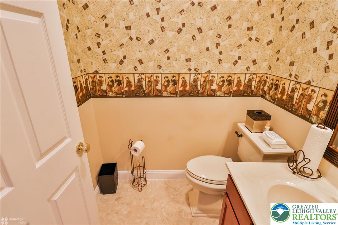 1991 Autumn Ridge Road Lower Macungie Township, PA 18062 - Photo 29 of 71 a bathroom with a toilet and a shower curtain