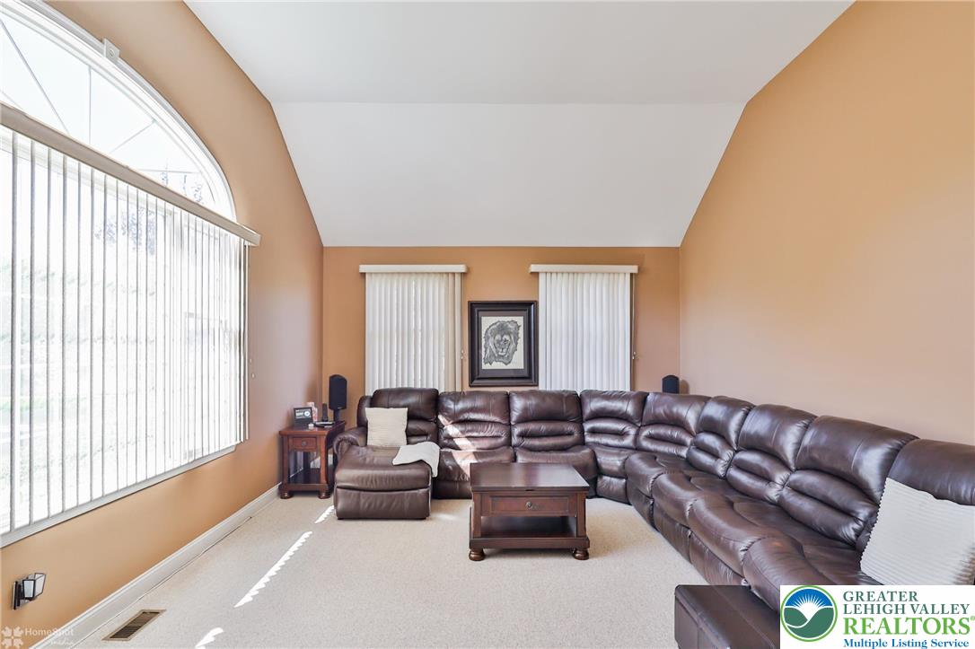 1991 Autumn Ridge Road Lower Macungie Township, PA 18062 - Photo 34 of 71 a living room with furniture and a large window