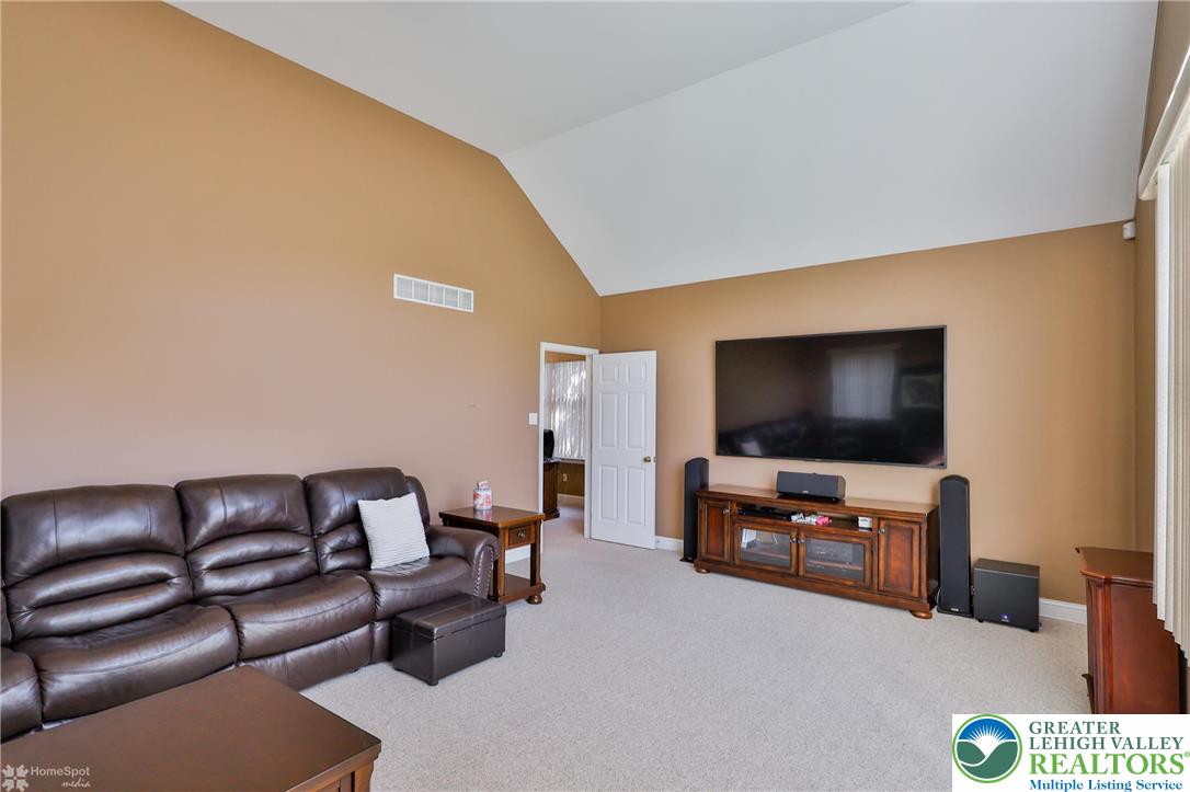 1991 Autumn Ridge Road Lower Macungie Township, PA 18062 - Photo 35 of 71 a living room with furniture and a flat screen tv