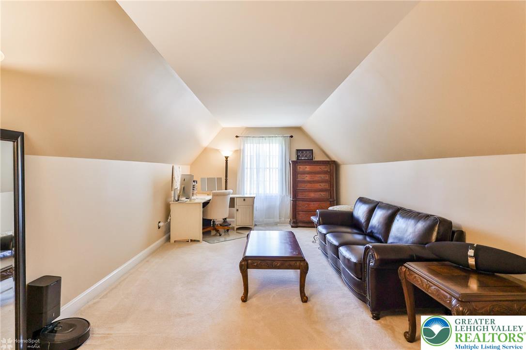 1991 Autumn Ridge Road Lower Macungie Township, PA 18062 - Photo 55 of 71 a living room with furniture and a couch