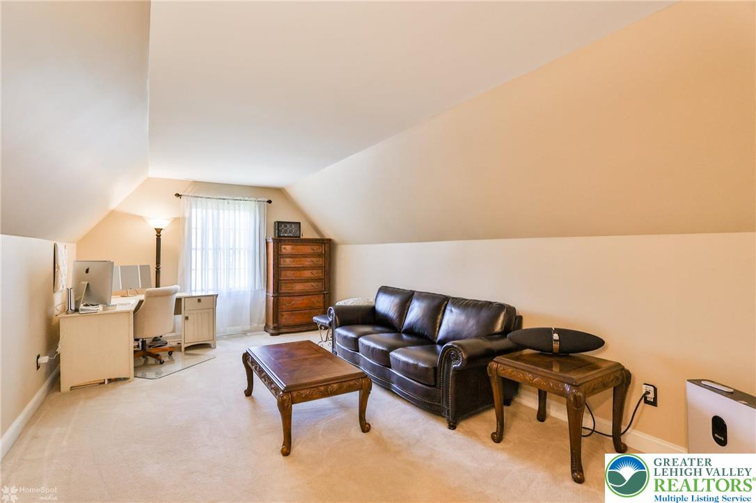1991 Autumn Ridge Road Lower Macungie Township, PA 18062 - Photo 56 of 71 a living room with furniture and a couch