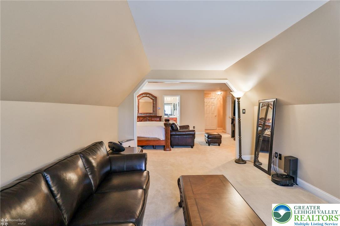1991 Autumn Ridge Road Lower Macungie Township, PA 18062 - Photo 57 of 71 a living room with furniture and a flat screen tv