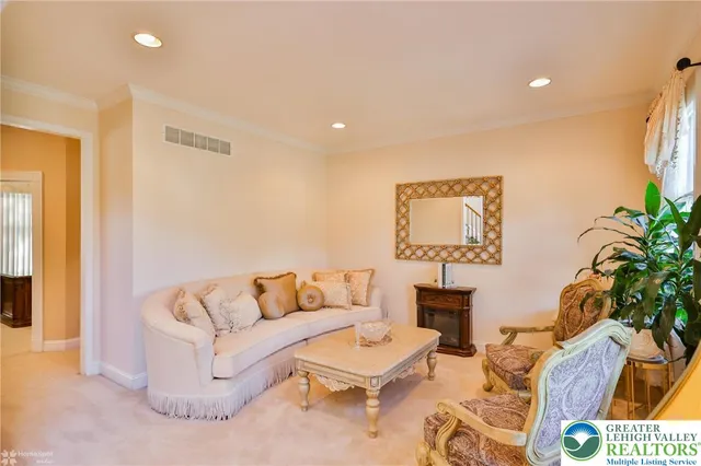 a view of a dining room with furniture and chandelier