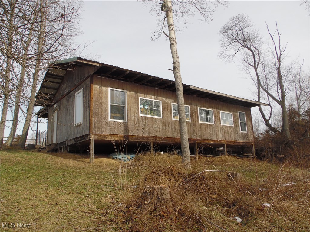1012 Mayle Ridge Road Cutler, OH 45724 - Photo 31 of 44 View of home's exterior featuring a yard