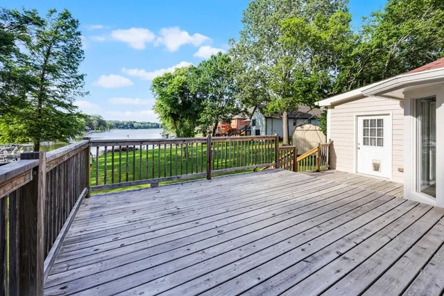 a kitchen with kitchen island sink refrigerator and cabinets
