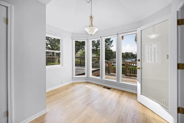 a spacious bathroom with a shower sink and mirror