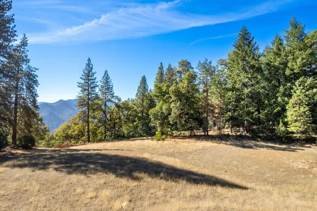 a view of a backyard of a house with a mountain