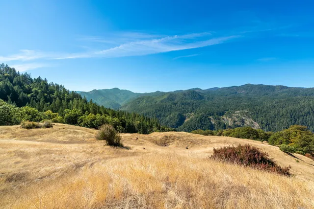 a view of mountain with lake