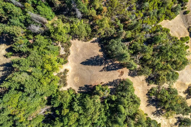 a view of a backyard of a house with a mountain