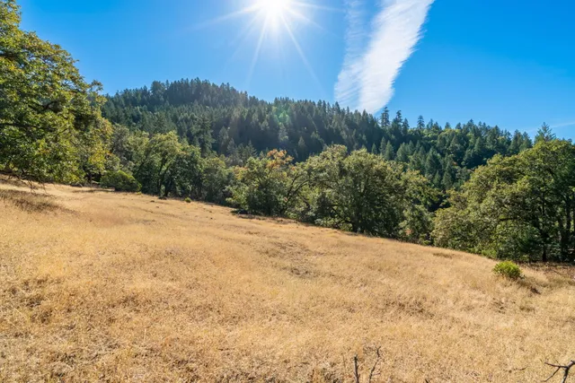 a view of a lake with mountains in the background