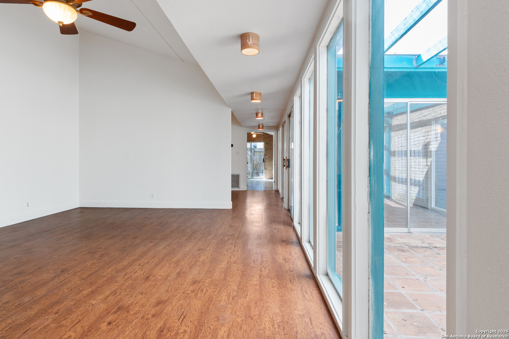 12031 Arms Way Street Live Oak, TX 78233 - Photo 14 of 24 a view of a hallway with wooden floor