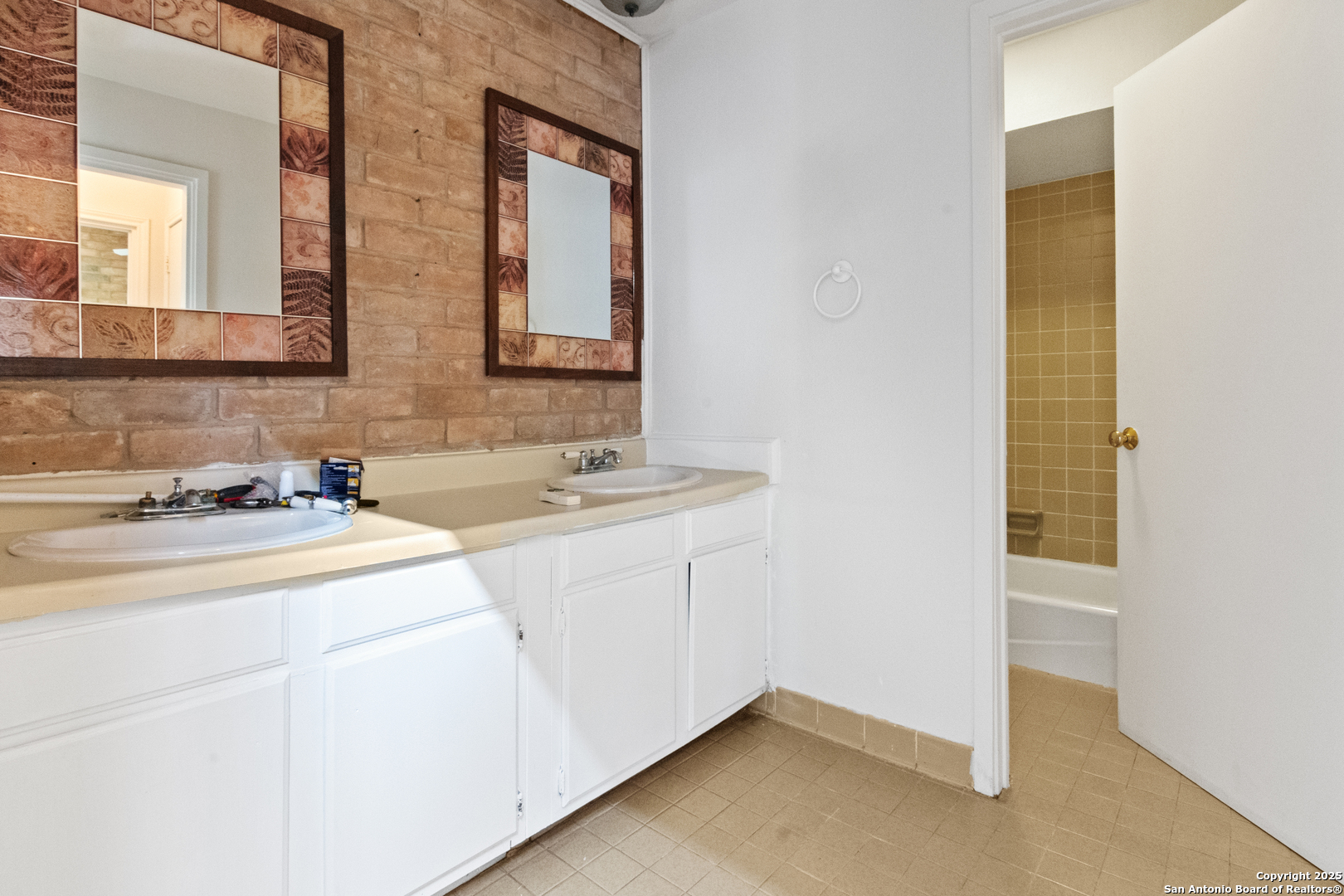 12031 Arms Way Street Live Oak, TX 78233 - Photo 7 of 24 a bathroom with a sink and a mirror