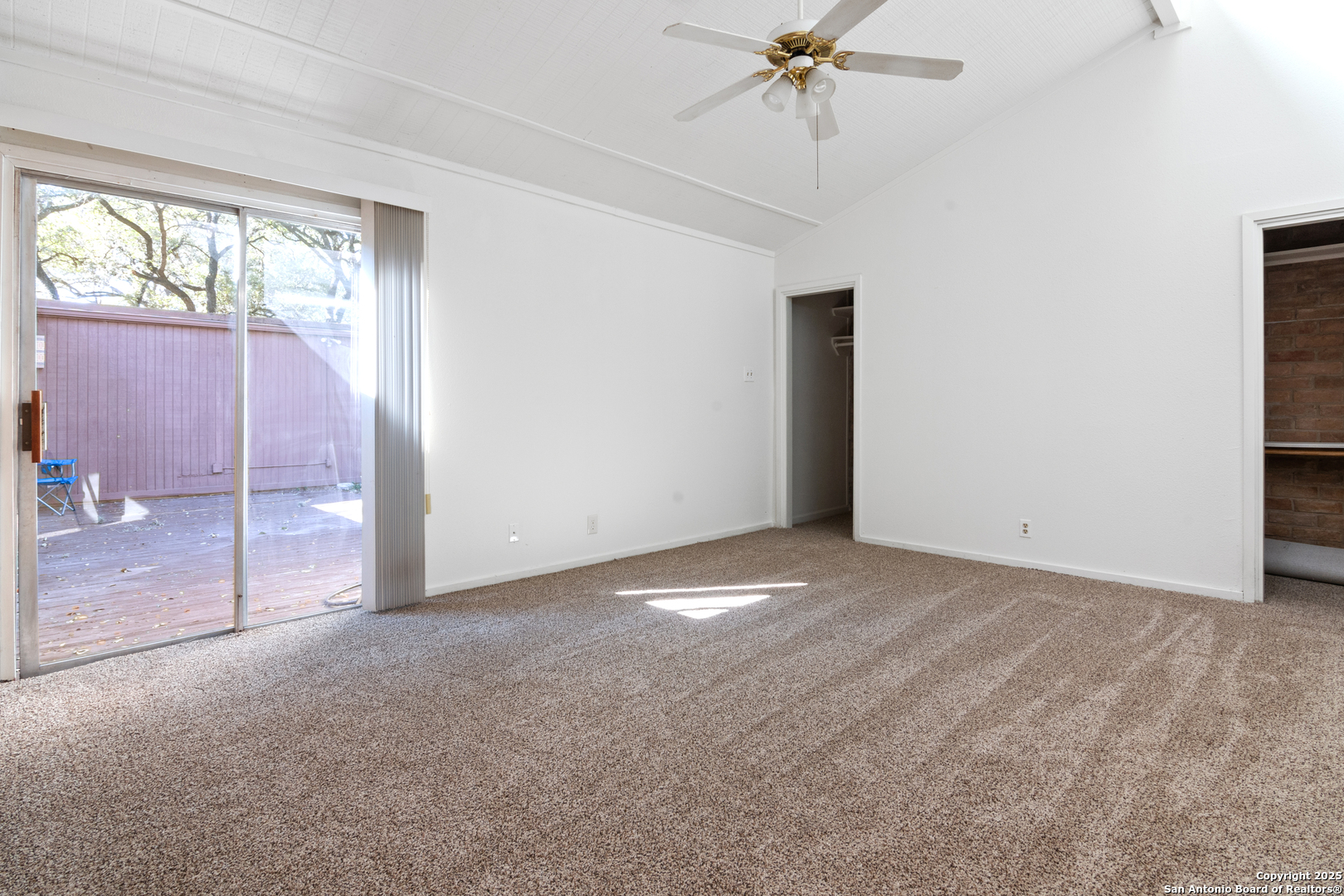 12031 Arms Way Street Live Oak, TX 78233 - Photo 9 of 24 an empty room with fan and windows