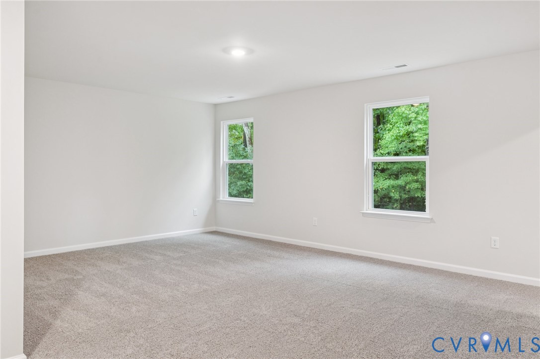 7784 Patriots Way Gloucester, VA 23061 - Photo 15 of 32 an empty room with windows