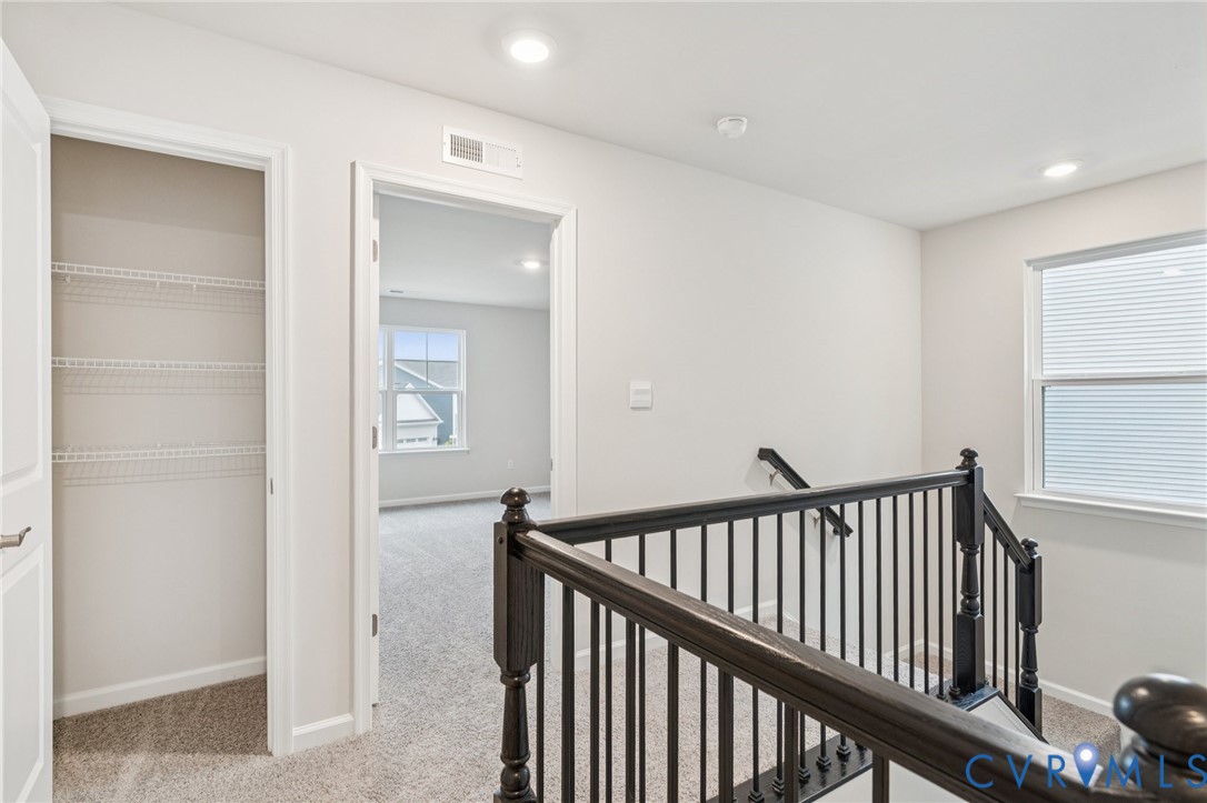 7784 Patriots Way Gloucester, VA 23061 - Photo 16 of 32 a view of a hallway with a bedroom