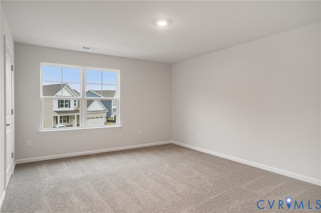 7784 Patriots Way Gloucester, VA 23061 - Photo 17 of 32 an empty room with a window