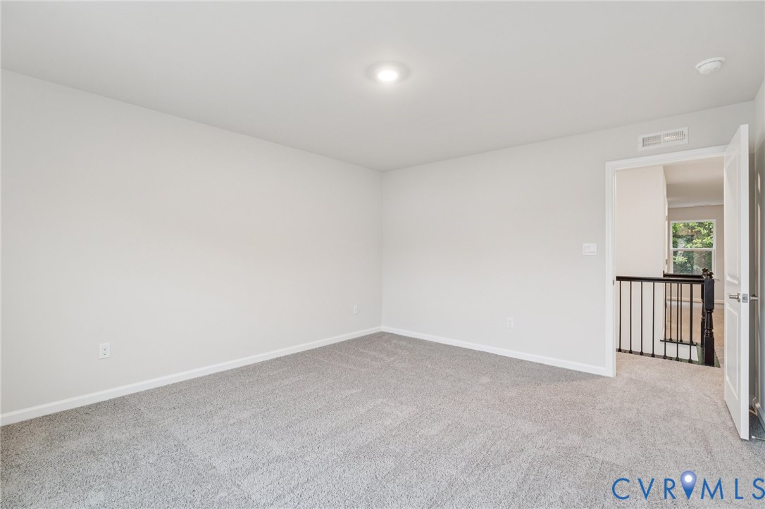 7784 Patriots Way Gloucester, VA 23061 - Photo 19 of 32 an empty room with windows