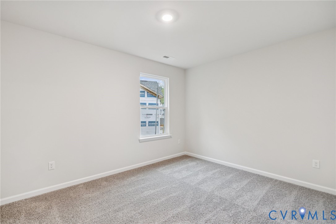 7784 Patriots Way Gloucester, VA 23061 - Photo 23 of 32 an empty room with a window