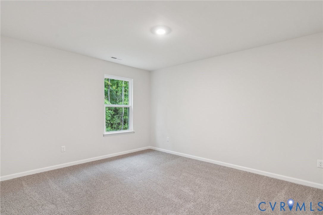 7784 Patriots Way Gloucester, VA 23061 - Photo 24 of 32 an empty room with windows