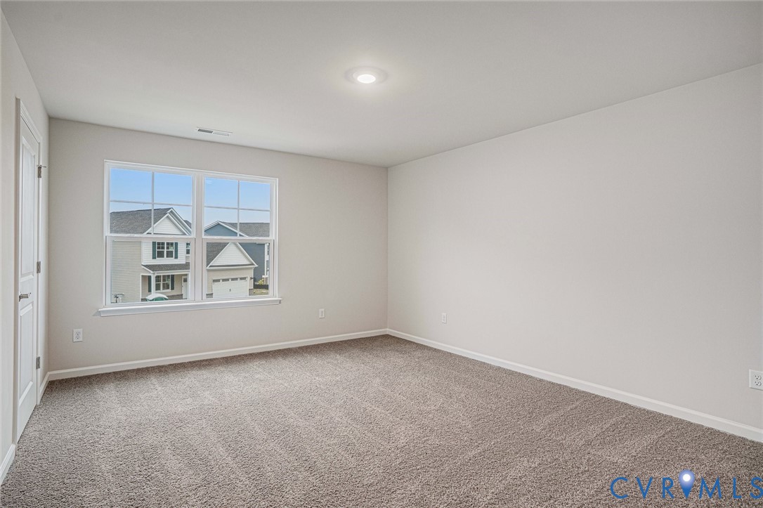 7784 Patriots Way Gloucester, VA 23061 - Photo 26 of 32 an empty room with windows