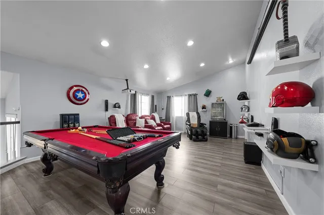 a living room with furniture window and wooden floor