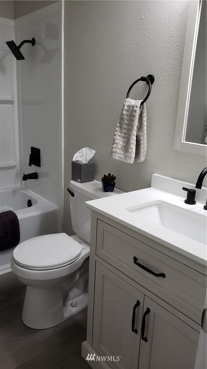 1040 Northeast Larson Boulevard Belfair, WA 98528 - Photo 15 of 31 a bathroom with a sink and a toilet