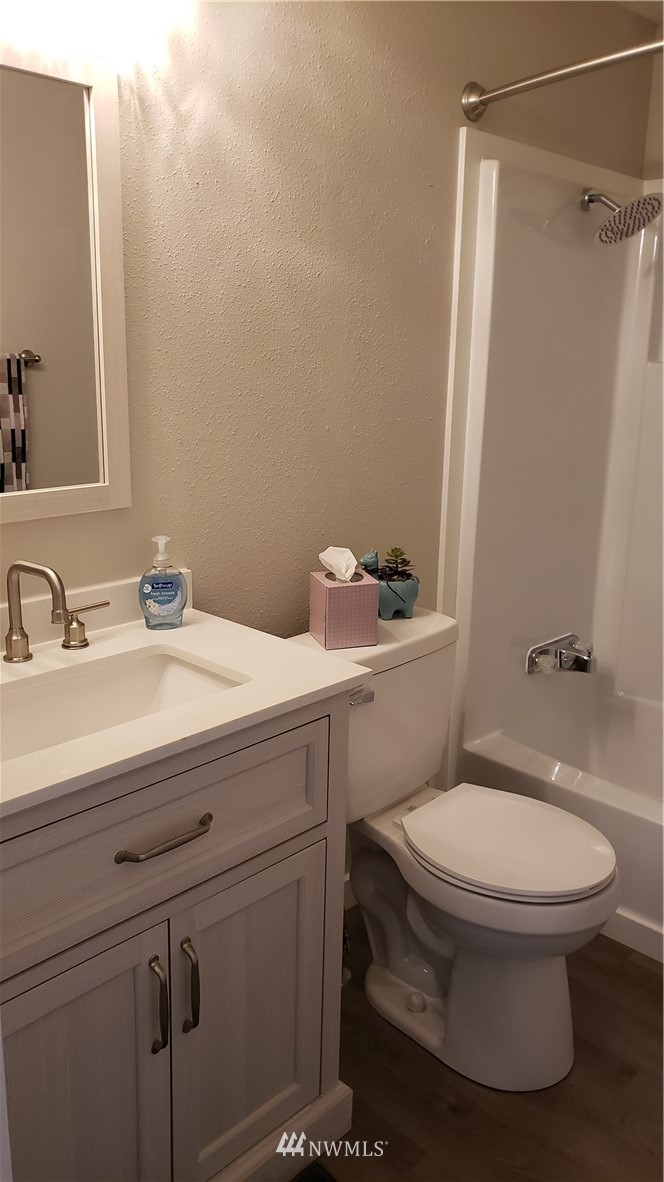 1040 Northeast Larson Boulevard Belfair, WA 98528 - Photo 20 of 31 a bathroom with a sink toilet and shower