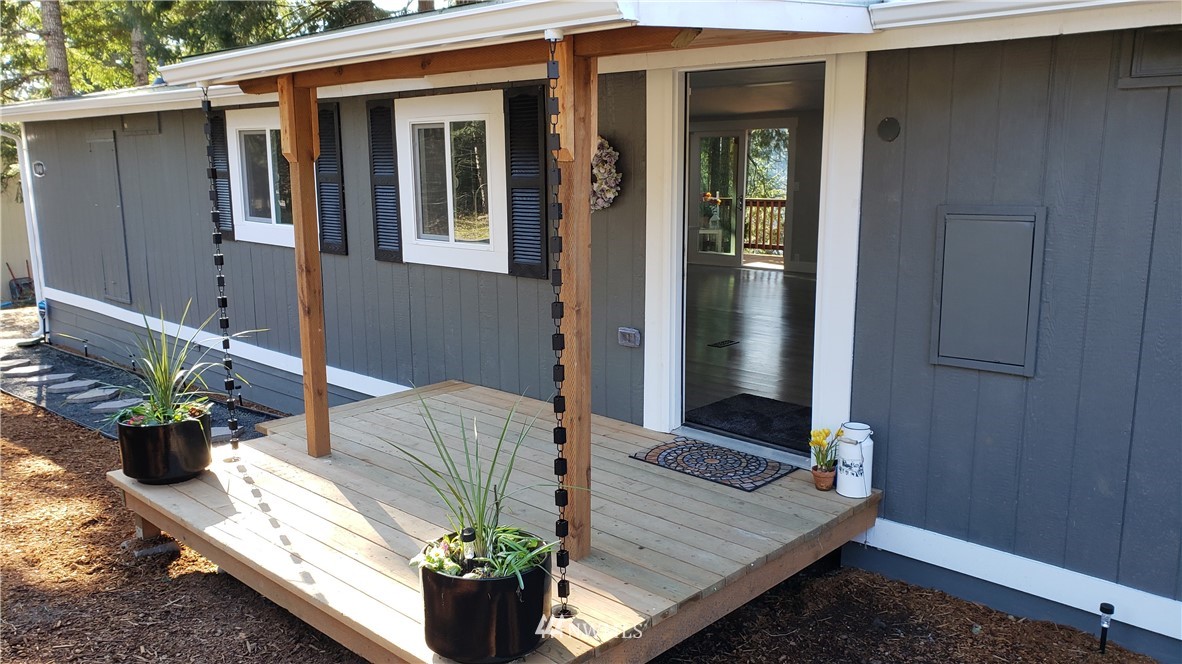 1040 Northeast Larson Boulevard Belfair, WA 98528 - Photo 3 of 31 a front view of a house