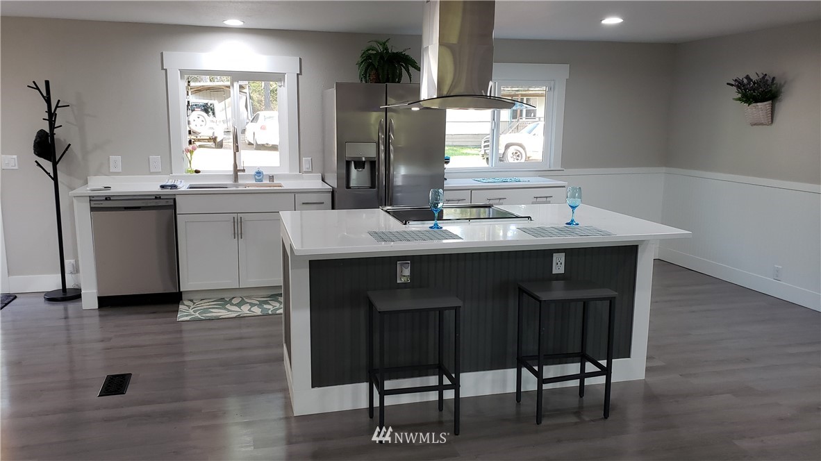 1040 Northeast Larson Boulevard Belfair, WA 98528 - Photo 8 of 31 a kitchen with a sink cabinets and window