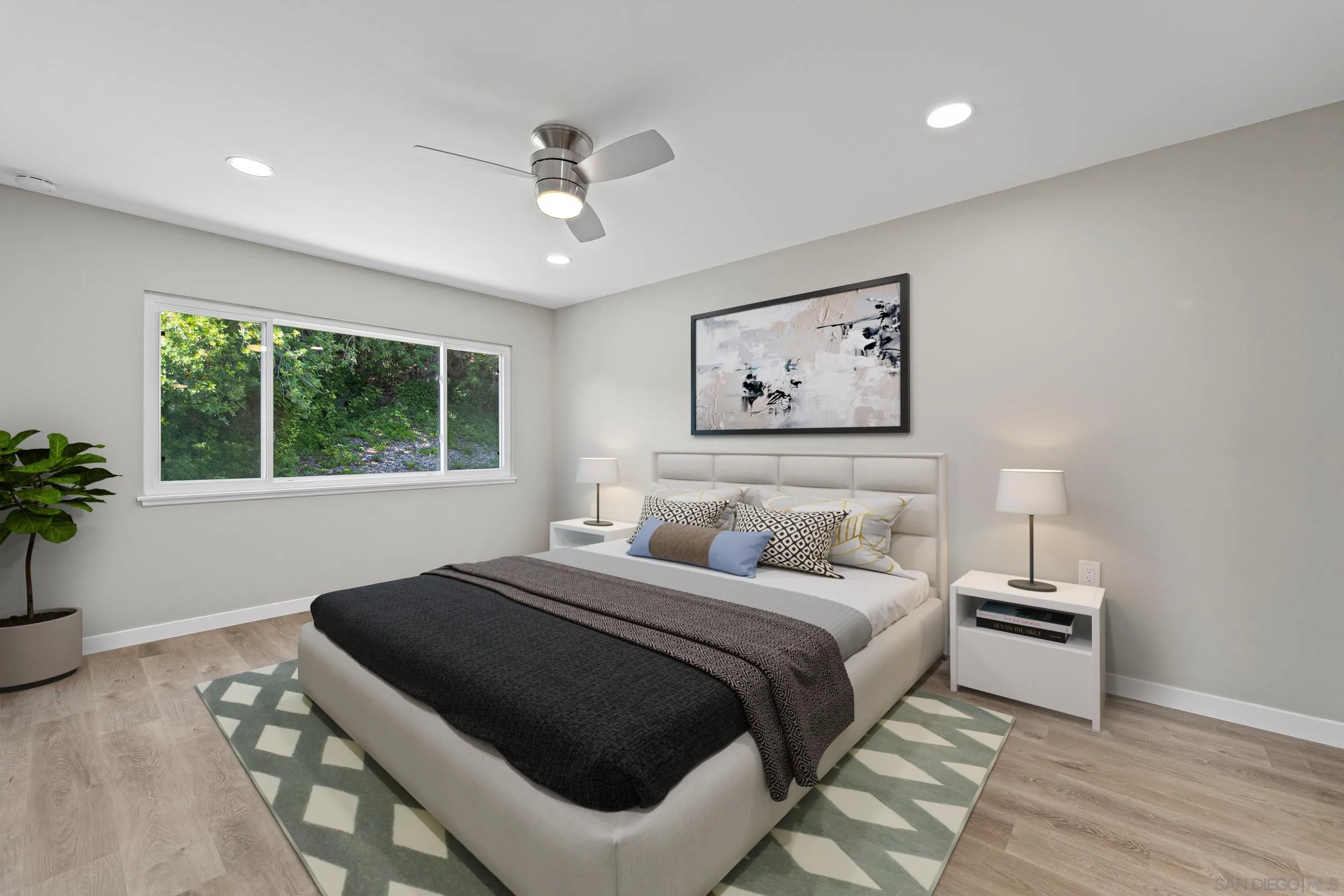 12424 Rios Road San Diego, CA 92128 - Photo 20 of 35 a bedroom with a large bed and a window