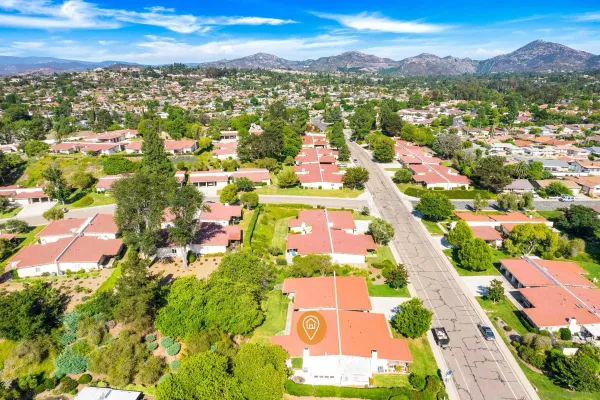 an aerial view of residential houses with outdoor space