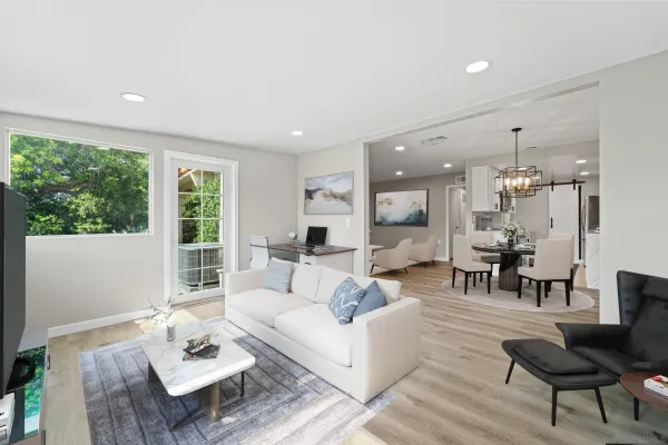 a living room with furniture and a large window