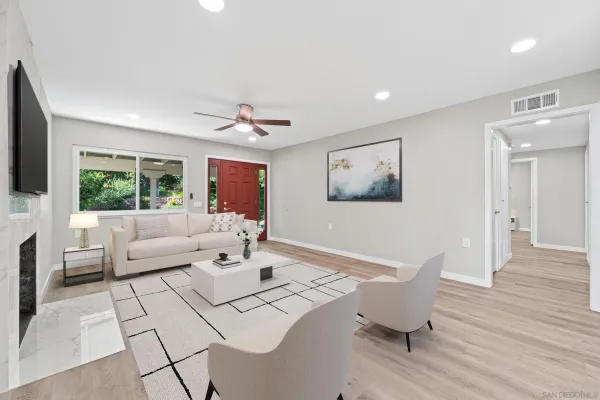 a living room with furniture and a large window