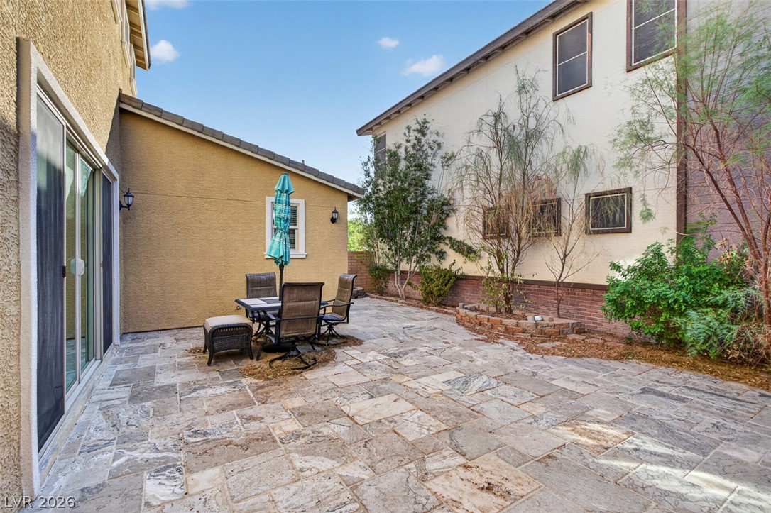 1100 East Sunset Road Henderson, NV 89011 - Photo 48 of 58 A spacious backyard patio, perfect for outdoor dining and entertaining.